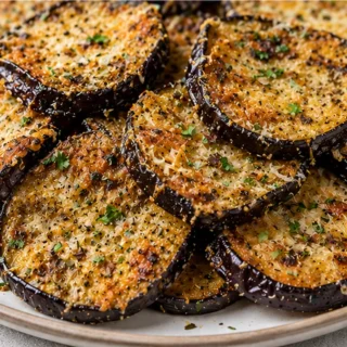 Crispy Air Fryer Eggplant Perfection! Discover crispy air fryer eggplant! This recipe uses simple ingredients for a perfectly cheesy and tender bite. Quick, eas