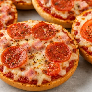 Ultimate Air Fryer Bagel Pizzas! Bagel pizza: Make these incredibly easy air fryer bagel pizzas in just 15 minutes! Perfect for a fast, cheesy snack or meal. Tr