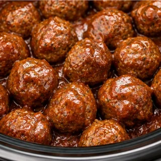 Easy Crock Pot Meatballs Recipe - Discover the easiest Crock Pot meatballs recipe! Melt-in-your-mouth flavor in under an hour. Perfect for game day or a quick f