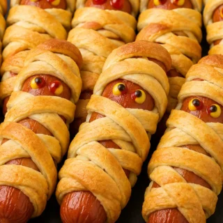 Spooky Mummy Hot Dogs: Easy Air Fryer Treat! - mummy dogs - Mummy dogs: Make these fun and spooky air fryer mummy hot dogs in under 30 minutes. Easy, crispy, an