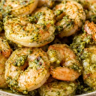 Pesto Shrimp Explosion! Pesto shrimp air fryer: Make this crispy, garlicky shrimp in under 20 minutes. Easy, flavorful, and perfect for appetizers or a light me