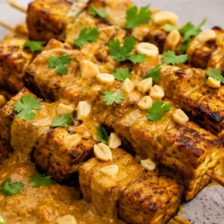 Crispy Tofu Satay: Your Weeknight Meal! Tofu satay: master these crispy, flavorful skewers with a rich peanut sauce. Perfect for air frying, baking, or grilling
