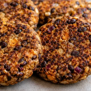 Crispy Sweet Potato & Black Bean Burgers - Black bean burgers: craft these flavorful and crispy sweet potato and black bean patties. Packed with spices, they're