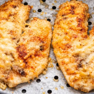 Crispy Parmesan Tilapia in Minutes! Parmesan tilapia: bake this crispy, high-protein fish in your air fryer in under 20 minutes. A healthy and delicious weeknig