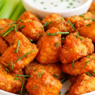 Crispy Buffalo Tofu Bites! Buffalo tofu: Whip up crispy, crunchy air fryer bites with Frank's RedHot sauce in under 30 minutes. The perfect spicy vegan snack or
